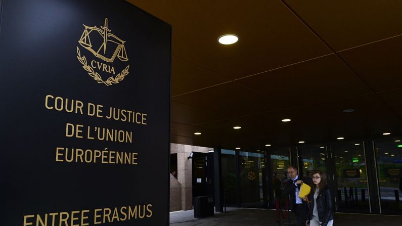 People walk away from the entrance of the European Court of Justice (SCJ) in Luxembourg, on October 5, 2015. The European Court of Justice (ECJ) on October 6, 2015 is to announce a verdict in the case of Schrems v Data Protection Commissioner of Ireland over Schrems's claims that his privacy data was allegedly violated Facebook within the scope of NSA mass surveillance programs. Austrian activist Schrems is suing for damages against the US firm on behalf of 25,000 Facebook users, arguing that Facebook collects and uses private data without adequate consent from users. Schrems also charges that Facebook has provided data to the National Security Agency (NSA), the US digital intelligence unit. AFP PHOTO / JOHN THYS (Photo credit should read JOHN THYS/AFP/Getty Images)
