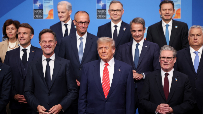 NATO Secretary General Mark Rutte, U.S. President Donald Trump, Britain's Prime Minister Keir Starmer, France's President Emmanuel Macron, German Chancellor Friedrich Merz, Greek Prime Minister Kyriakos Mitsotakis and Hungarian Prime Minister Viktor Orban pose for a family photo with NATO leaders during a NATO leaders summit in The Hague, Netherlands June 25, 2025. REUTERS/Claudia Greco